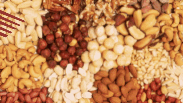 a variety of nuts are laid out in a pile