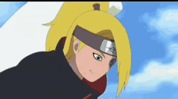 a close up of a cartoon character with yellow hair and a headband on his head .