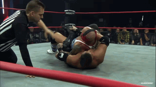 two wrestlers in a ring with the word impact on it