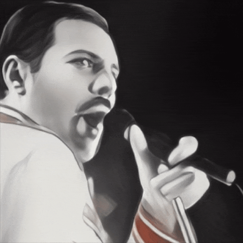 a man singing into a microphone with his tongue out