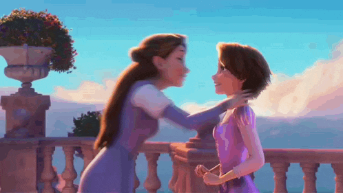 a woman in a purple dress is hugging another woman in a purple dress on a balcony .