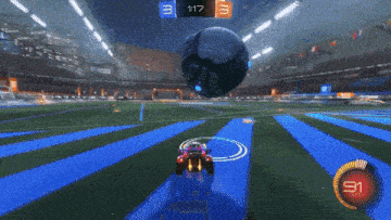a rocket league game is being played in a stadium and the time is 1:17