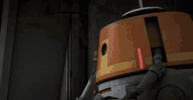 a close up of a robot with a red light on its head