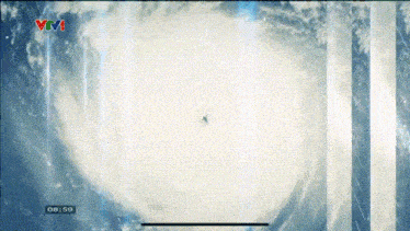 a tv screen shows a storm and the time of 8:59
