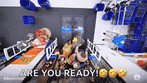 a group of people are standing around a conveyor belt in a supermarket .
