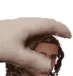 a close up of a person 's head with a cat 's paw on it .