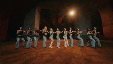 a group of women are dancing in a row