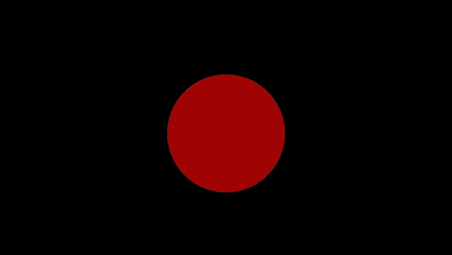 a red circle on a black background is spinning