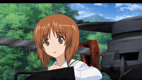 a girl with brown hair and a white shirt has a n on her forehead