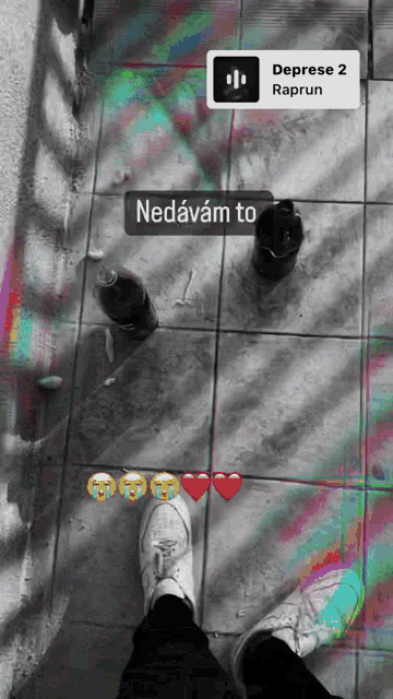 a black and white photo of a person 's feet next to a bottle of coke and a bottle of raprun