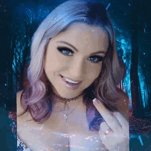 a woman with purple hair and blue eyes is smiling in front of a dark forest