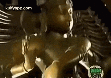 a close up of a statue of a woman with wings .
