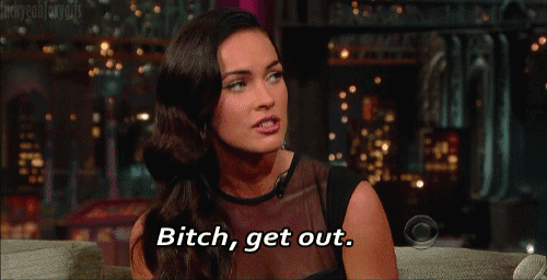 a woman sitting on a couch with the words bitch get out below her