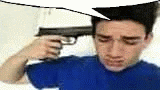 a man is holding a gun to his head with a speech bubble .