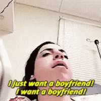 a woman is laying in a hospital bed and saying i just want a boyfriend .