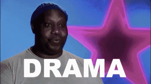 a man is standing in front of a star and the word drama is written on the screen