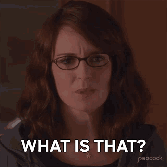 a woman wearing glasses and a necklace says what is that