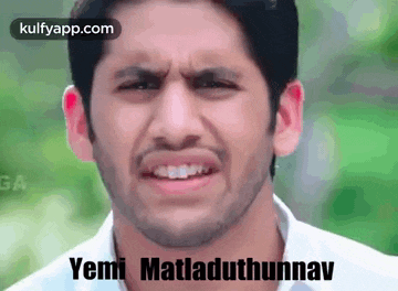 a man with a beard is making a funny face with the words yemi matladuthunnav written below him .