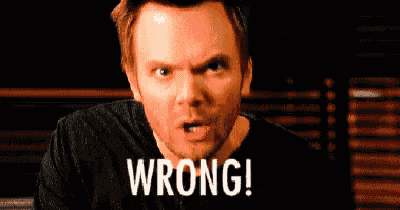 a man is making a funny face with his mouth open and the words wroooong written on his face .