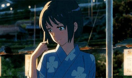 a girl in a blue kimono with white flowers