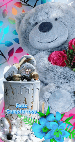 a teddy bear is sitting next to a cake that says feliz cumpleanos on it