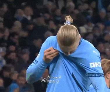 a man in a blue shirt has the word sirdlv on the bottom of his shirt