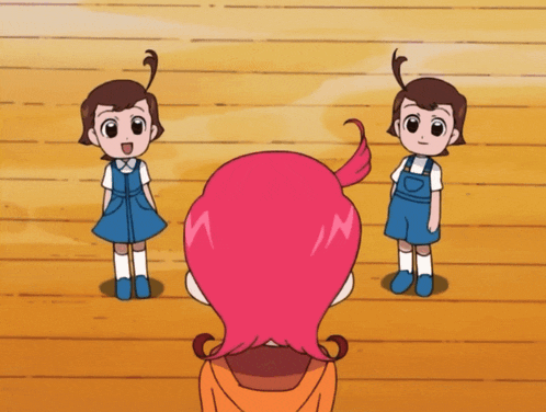a girl with pink hair is standing in front of two boys