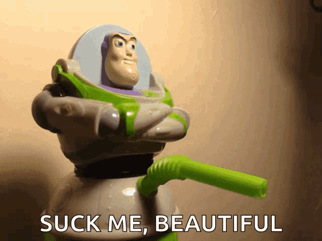 a toy story character with a green straw and the words " suck me beautiful "