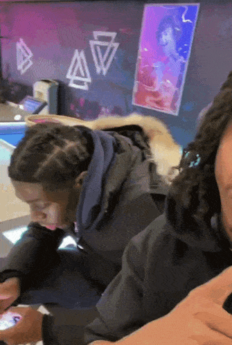 a man with dreadlocks is playing a video game