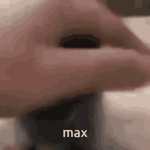 a close up of a person 's face with the word max written below it