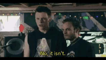 two men are standing next to each other and one of them is saying no it isn 't