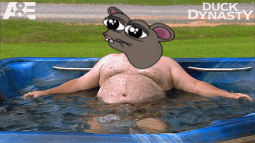 a fat man is laying in a hot tub with a cartoon mouse on his head