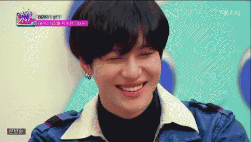 a young man is smiling in front of a screen that says 1 of 1 on it