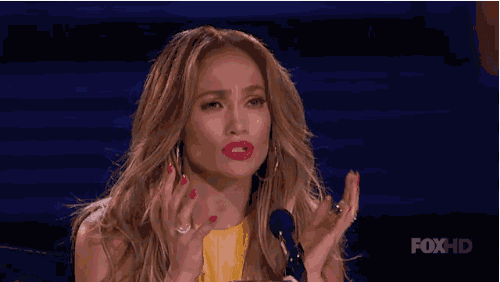 a woman is giving a speech on a stage and says `` deal with it '' .