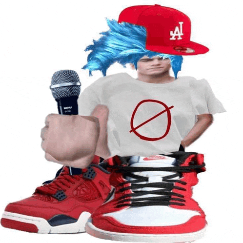 a person wearing a la hat holding a microphone next to a pair of red sneakers