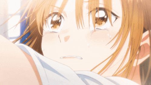 a close up of a girl with tears coming out of her eyes