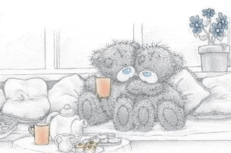 two teddy bears are sitting on a couch holding cups of tea .