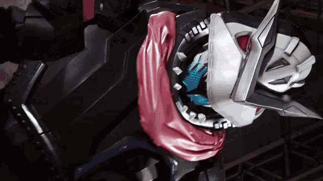 a close up of a robot 's arm with a helmet on it
