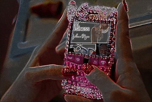 a woman holding a phone that says ' some real business '