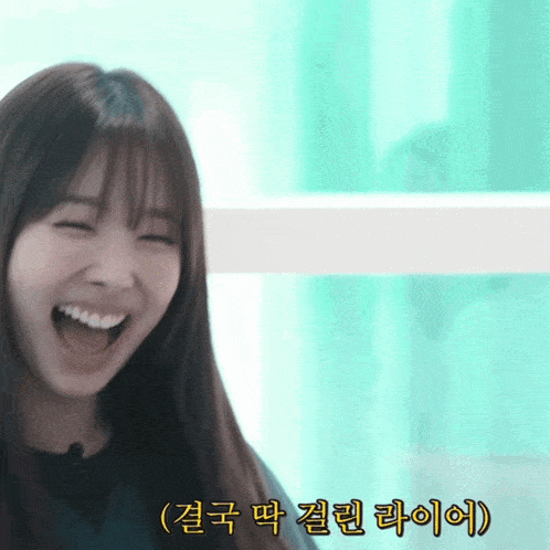 a woman is laughing with chinese writing on the bottom right