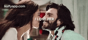 a woman is kissing a man on the cheek with the words `` i love her '' written on it .
