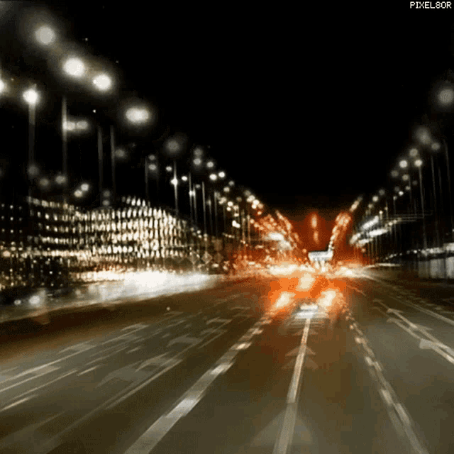 a blurry picture of a highway at night with the words pixel80r below it