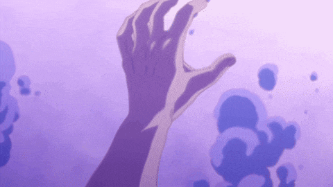 a person 's hand is reaching for something in the water