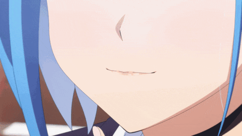 a close up of a girl with blue hair