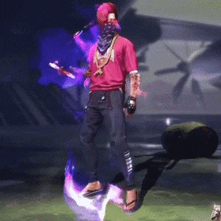 a man in a red shirt is jumping in the air with a purple background .
