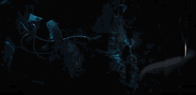 a dark room with a smoke coming out of it