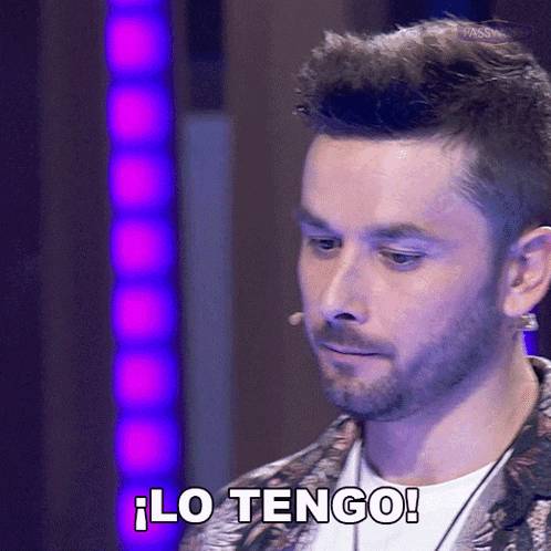 a man with a beard says " lo tengo " in spanish