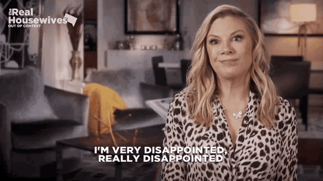 a woman in a leopard print shirt says i 'm very disappointed and really disappointed