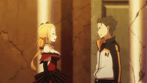 a man with the letter n on his jacket stands next to a girl
