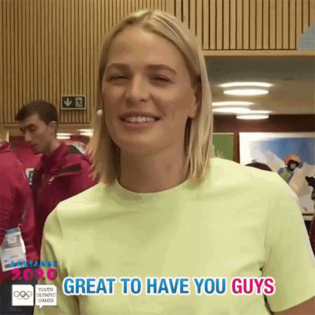 a woman says great to have you guys in a yellow shirt